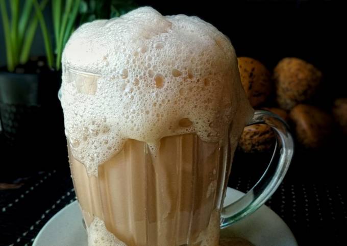 Teh Tarik, the iconic Malaysian "pulled tea," captivates with its silky smooth texture, balanced sweetness, and a mesmerizing pouring technique that enhances the flavors, making it a beloved beverage enjoyed by many.